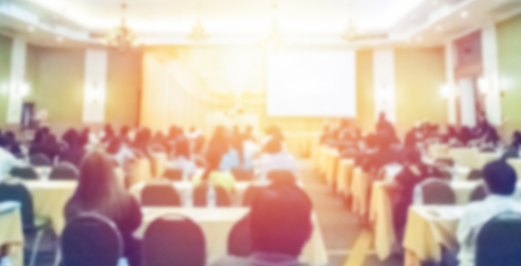 Event with attendees seated facing the front of the room